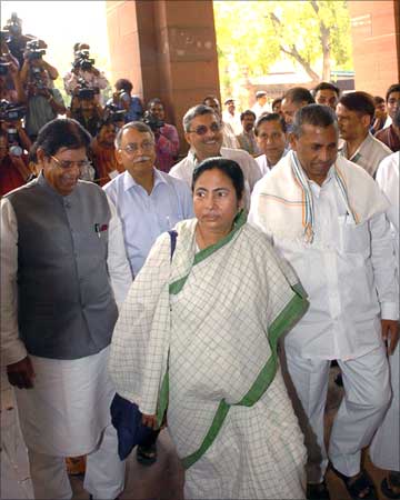 Union Minister for Railways, Mamata Banerjee arrives at Parliament House along with her deputies E Ahamed and K H Muniyappa to present the Rail Budget 2009-10, in New Delhi on July 03, 2009.