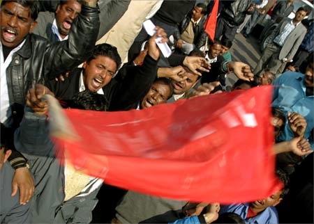 Employees of the Airports Authority of India shout slogans during a protest in New Delhi.