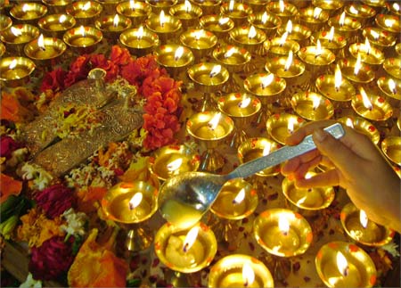 A devotee lights lamps during the Navratri festival at a temple in Amritsar.