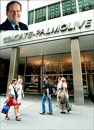 People pass the entrance of Colgate-Palmolive World headquaters in New York , Ian M Cook (Inset).