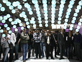 Visitors watch a presentation about cloud computing at the IBM booth at the CeBIT computer fair.