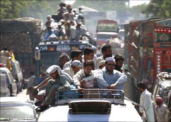 Residents returning to Buner district are seen stuck in a traffic jam in Mardan, near Islamabad.