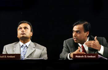 Mukesh Ambani and his brother, Anil, at an RIL AGM in Mumbai in June 2004.