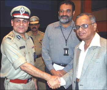 CISF Inspector General (western sector) R K Mishra with Infosys chief mentor N R Narayana Murthy and Infosys board member Mohandas Pai in Bangalore.