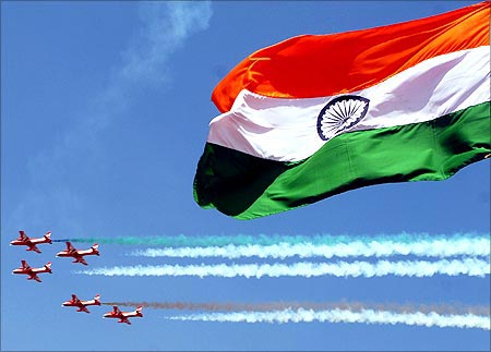 Pilots from the Surya-Kiran aerobatic demonstration team of the Indian Air Force perform during the 'Aero India 2007' show at the Yelahanka air force station on the outskirts of Bangalore.