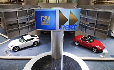 Cars are seen on display inside the General Motors Corp world headquarters in Detroit.