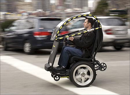 The Project P.U.M.A. prototype is shown during a test drive in Brooklyn, New York in April 2009. General Motors and Segway are developing an electric two-seat prototype vehicle with just two wheels, which could allow people to travel around cities more quickly, safely, quietly and cleanly, and at a lower total cost.