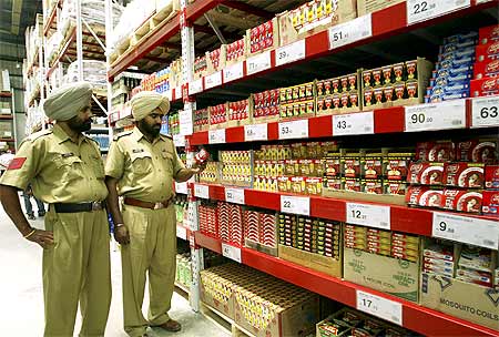 Policemen stand inside the first cash-and-carry Wal-Mart store during its inauguration in Amritsar.