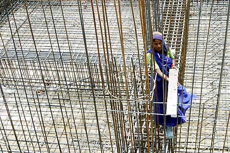A woman labourer works at a construction site in Chandigarh.