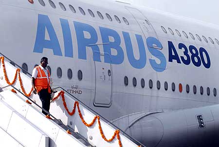An Indian official disembarks from an Airbus A380, the world's largest passenger aircraft.