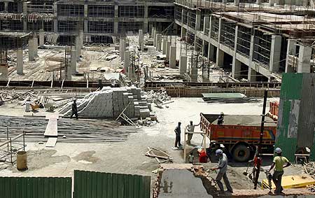 Labourers work at the construction site of a building in Mumbai.