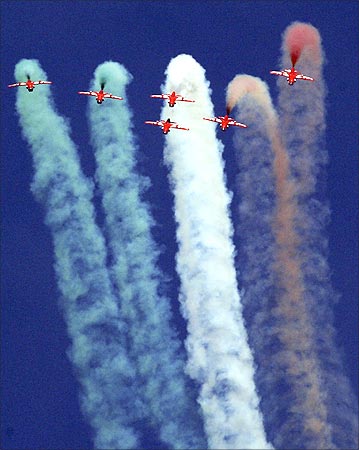 Indian Air Force Suryakiran jet trainers perform during the Aero India 09 in Bangalore