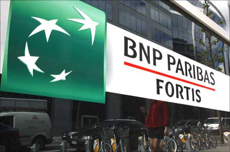 The new logo of financial group BNP Paribas Fortis is seen on the window of a bank in Brussels.