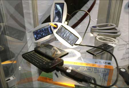 A Solio hybrid solar charger, which is being charged through its solar panels or the grid, is displayed at the GSMA Mobile World Conference in Barcelona on February 18, 2009.