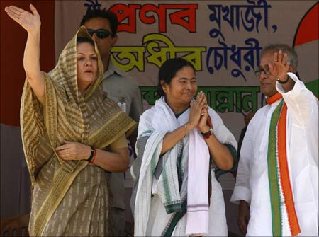 Congress President Sonia Gandhi (L-R), Railway Minister Mamata Banerjee and Finance Minister Pranab Mukherjee.