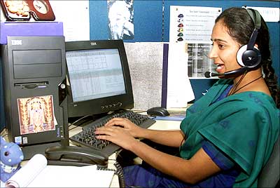 A female employee answers a call at a Bangalore-based BPO.