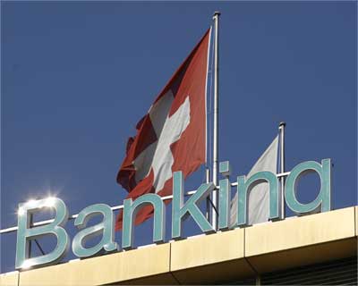 A Swiss flag is pictured on top of the Dresdner Private Banking building in Geneva.