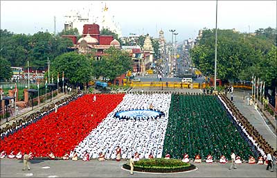 Children dressed in the colours of the national flag rehearse in front of Red Fort, New Delhi.