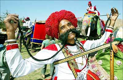 Ramnath Choudhary shows off his long moustache during an elephant festival in Jaipur.