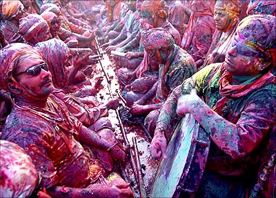 People celebrate Holi, the festival of colours, at Nand Gaon in Uttar Pradesh.