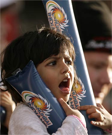 A cricket fan watches during the 2009 Indian Premier League T20 cricket tournament match.