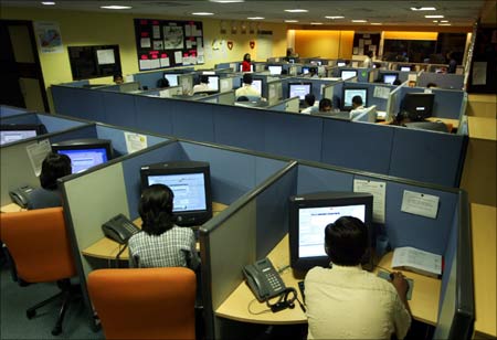 Indian employees at a call centre in Bangalore provide service support to international customers.