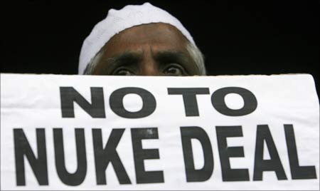 An activist holds a placard to protest against India's civilian nuclear deal with the United States in Mumbai.