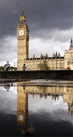 Britain's Houses of Parliament and Big Ben clock tower are reflected in a puddle