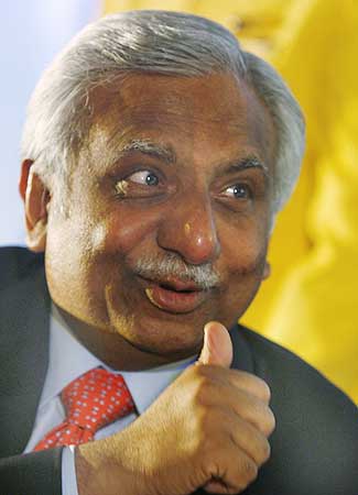 Naresh Goyal, chairman of Jet Airways, gestures at a press conference