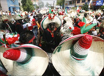 Mexicans wearing period costumes re-enact the battle of Puebla in Mexico City.