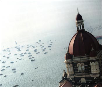 The domes of the Taj Mahal hotel are seen in front of the Arabian Sea in Mumbai.