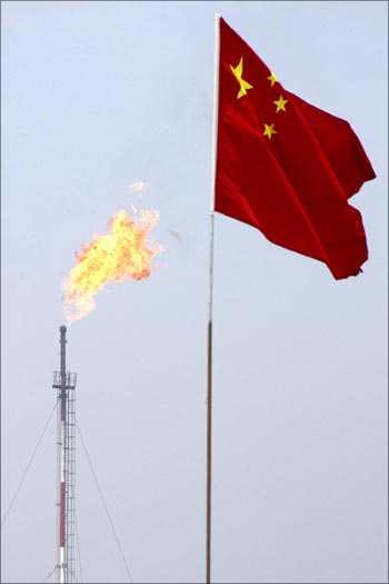 A Chinese flag flutters at the Jidong Nanpu oilfield in Bohai Bay.