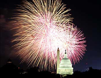 Fireworks explode over the United States Capitol dome and Washington Monument on Independence Day in Washington.