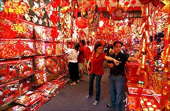 People shop for Chinese New Year decorations at a store in Singapore's Chinatown.