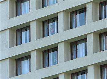 Guests look out of the window while terrorists attacked the hotel on Nov 26, 2008.