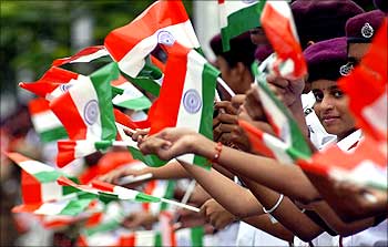 School children wave India's national flag during the Independence Day celebrations in the southern Indian city of Chennai.