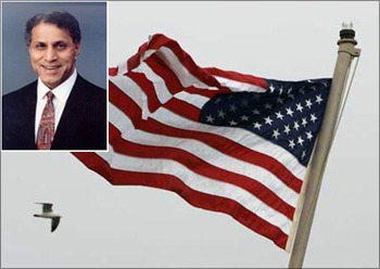 (Inset) Romesh Wadhwani. The American flag flutters.