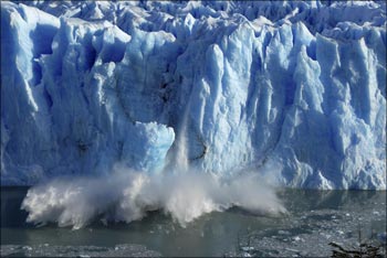 Splinters of ice peel off from one of the sides of the Perito Moreno glacier.