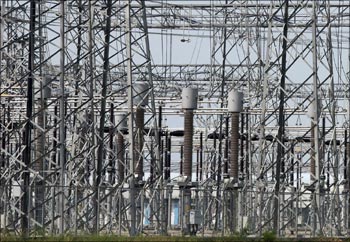 Power transmission lines are seen inside a power project at Kamrej, near Ahmedabad.