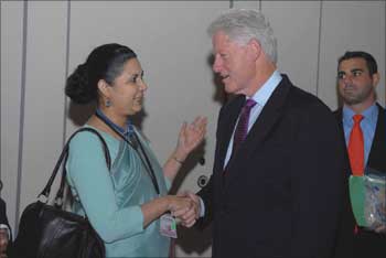 Meera Shankar, the Indian ambassador to the US, shakes hand with Clinton.