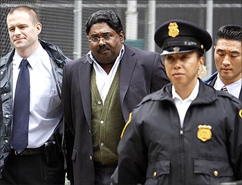 Raj Rajaratnam is escorted by FBI agents after being taken into custody in New York.