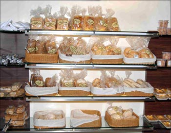 Some of the breads, pastries, etc on display at a Hot Breads outlet.