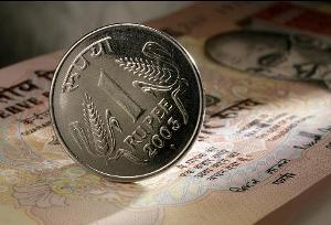 Indian rupee and a coin