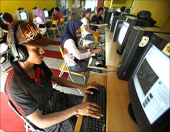 Internet users surf at a cyber cafe.