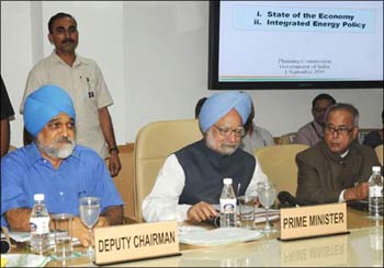 Prime Minister Manmohan Singh, Planning Commission Deputy Chairman Montek Singh Ahluwalia and Finance Minister Pranab Mukherjee at the Planning Commission meet in New Delhi on Tuesday.