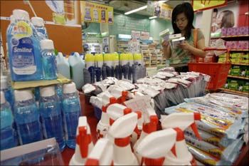 A customer looks at face masks in the anti-flu section at a supermarket in Taipei.