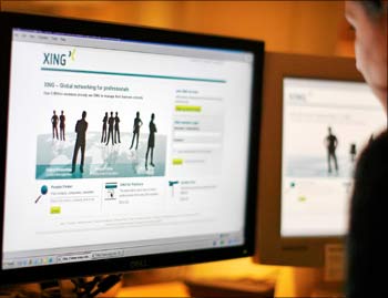 A web-user views a global networking site called Xing in Stockholm.