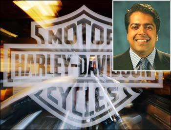 Motorcycle maker Harley Davidson's logo on the window of store in Boston. (Inset) Anoop Prakash, Managing Director, Harley-Davidson India.
