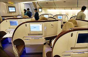People look at the newly introduced premier class cabin in a Jet Airways Boeing 777-300.