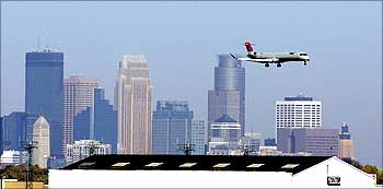 A Northwest Airlines jet lands at the Minneapolis St. Paul International Airport.